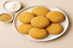 آموزش تهیه شیرینی کنجدی نارگیلی